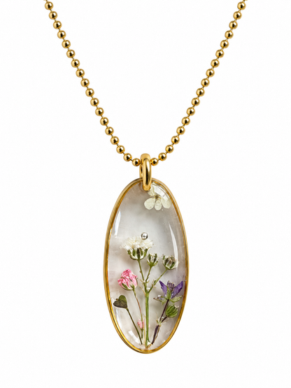 Goudkleurige ketting met transparante bloemenhanger – echte droogbloemen