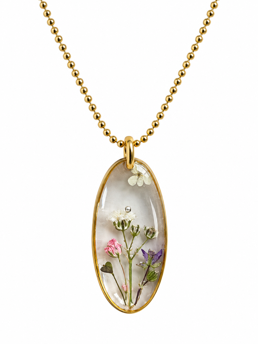 Goudkleurige ketting met transparante bloemenhanger – echte droogbloemen